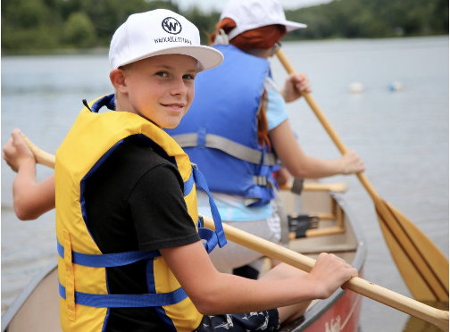 summer_camp_boy_on_canoe