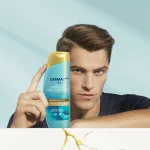 Infografia: hombre con una botella de producto Head&Shoulders DERMAxPRO