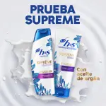 Poster "prueba supreme" con dos botes de champú y acondicionador REPARA y aceite de argán