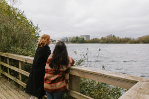 Two people looking at the lake at Rushden Lakes
