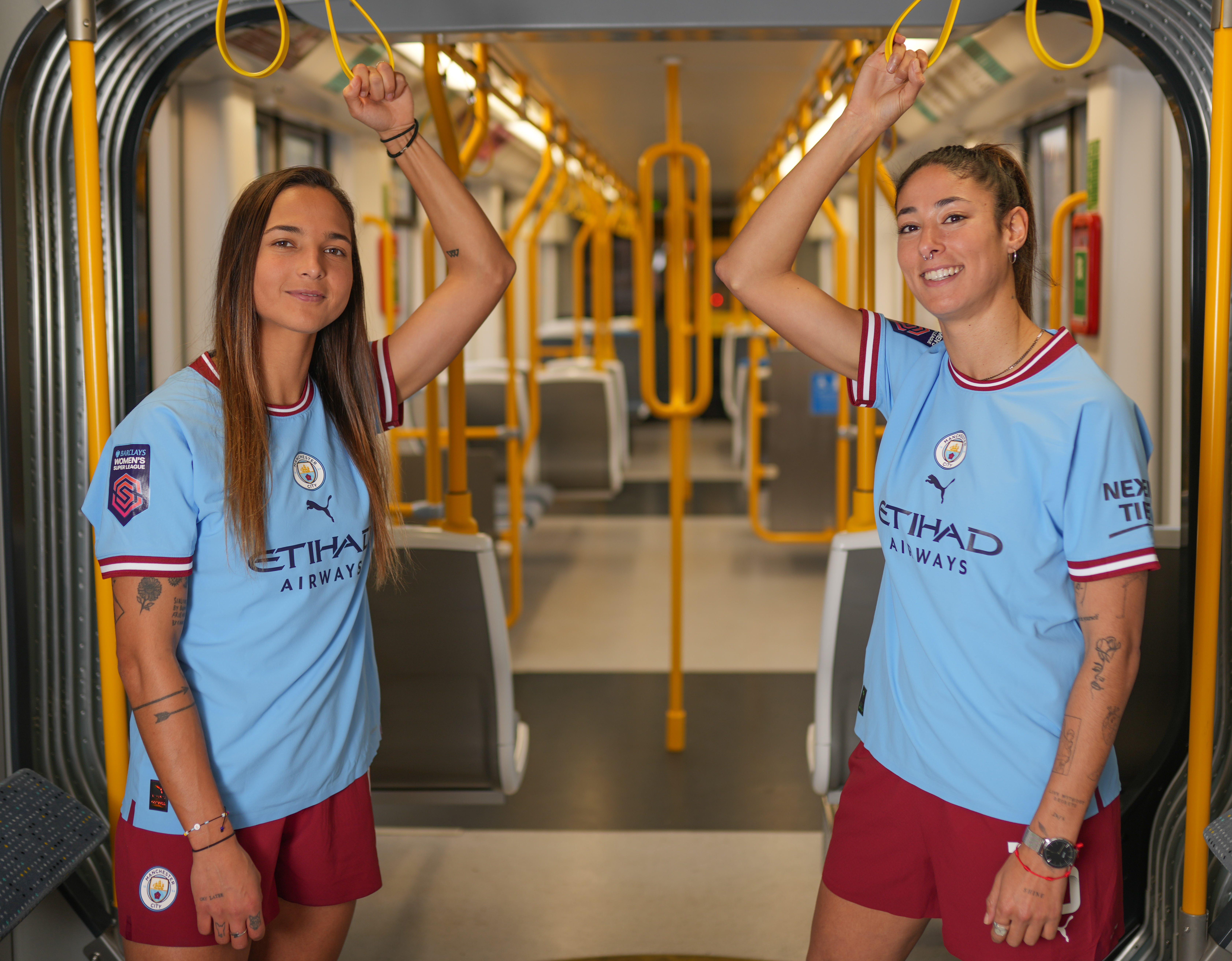 Man City women's football team travelling on the tram