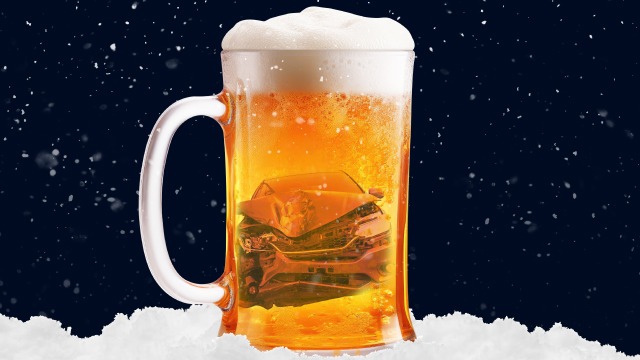 Pint glass with a crumpled car in the drink