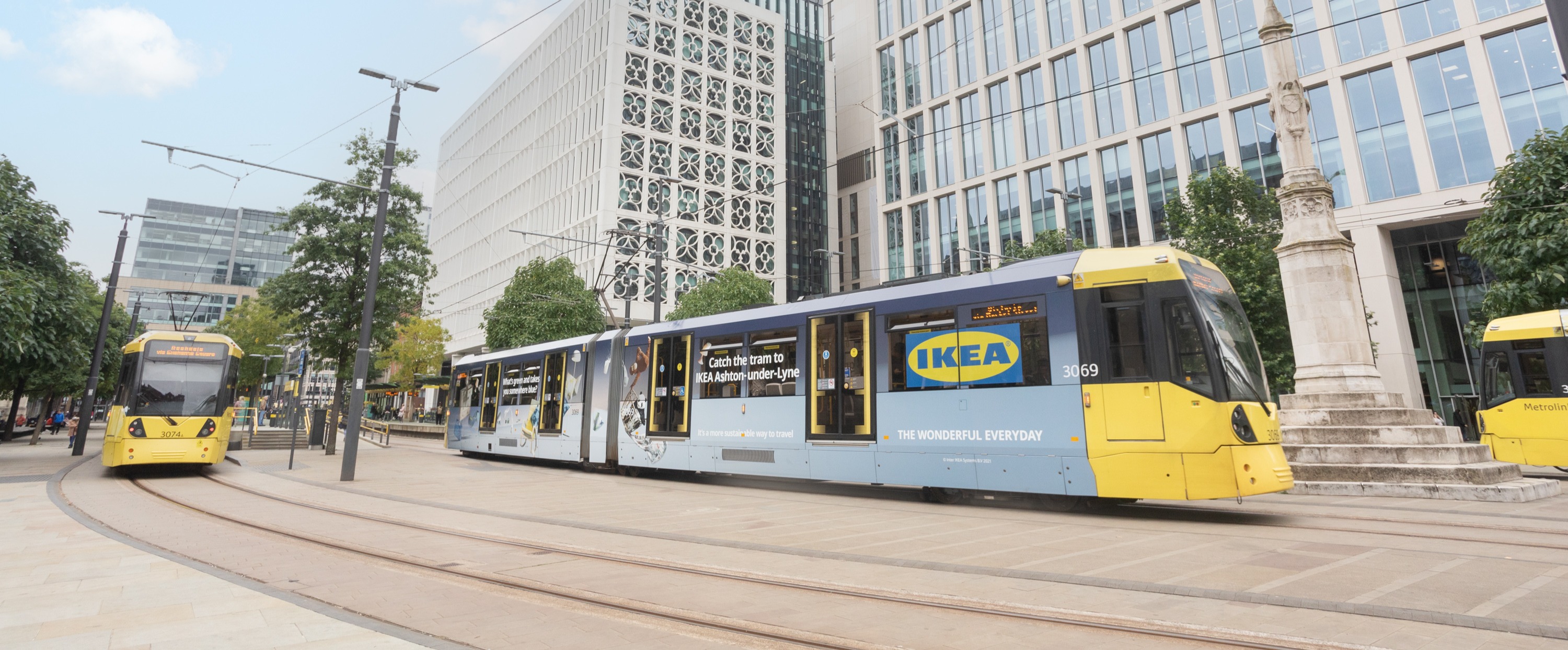 Metrolink tram in Manchester city centre with Ikea advert on the side