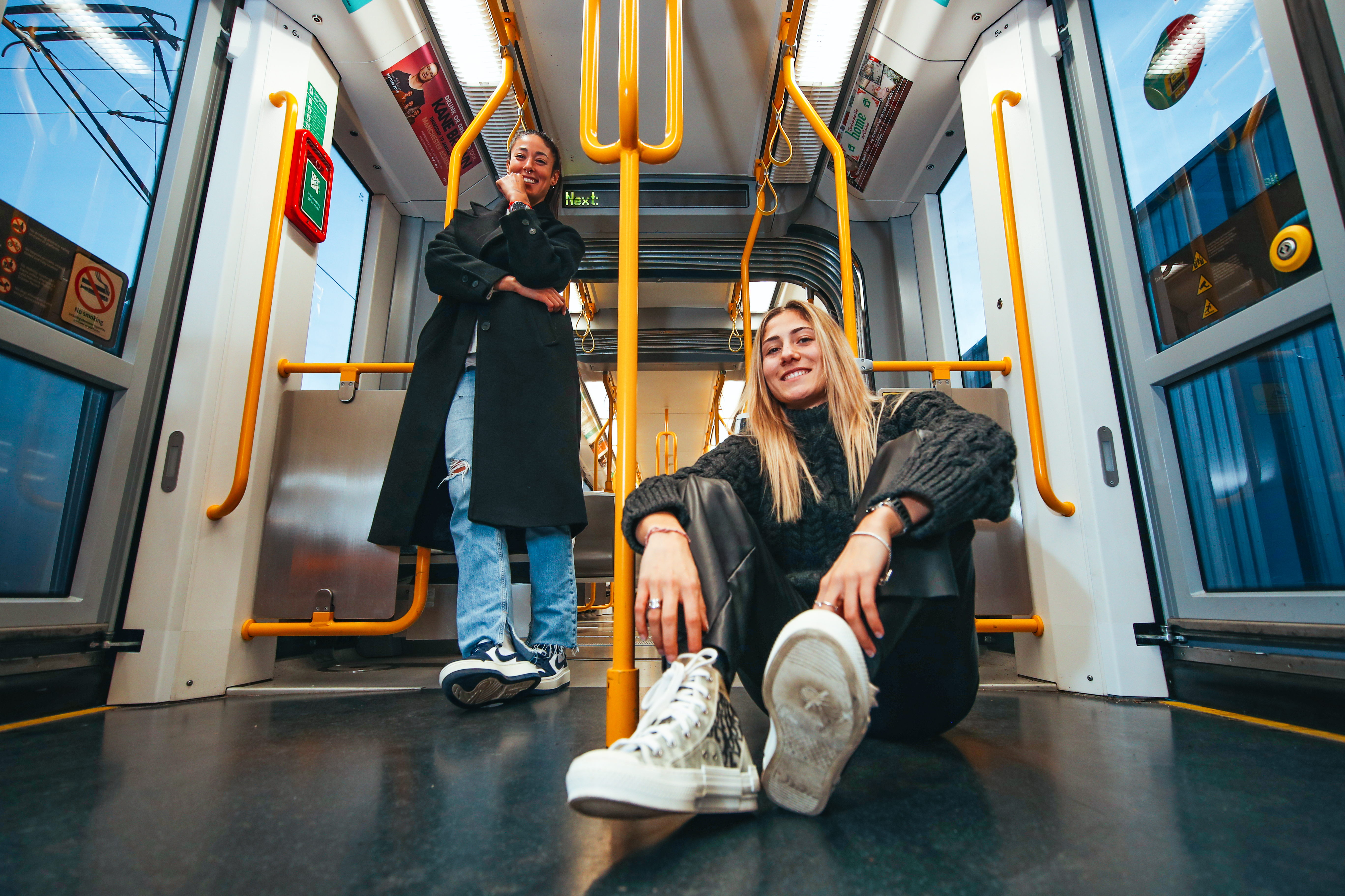 Man City women's football team sat on the tram