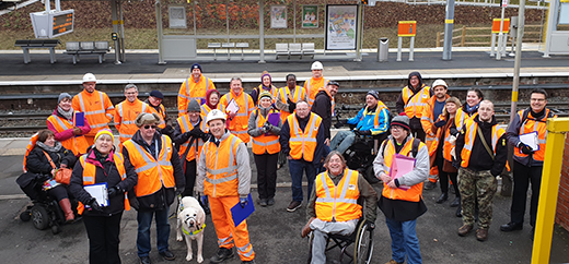 Our Disability Design Review Group smiling at the camera at a Metrolink stop