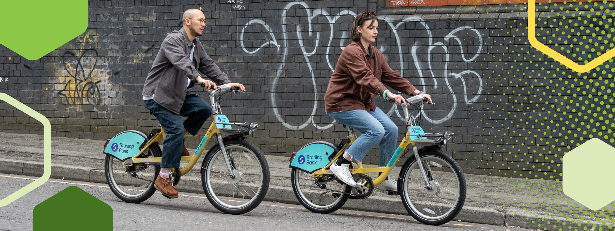 Two students cycling to university