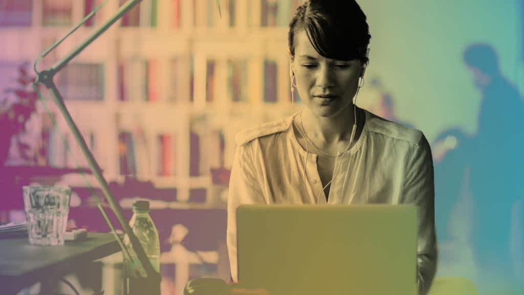 A women working at her desk on her laptop on Early Talent Technology Careers