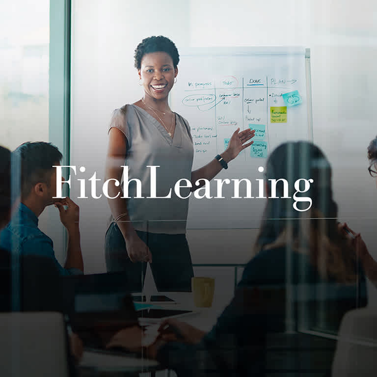 Woman presenting in front of colleagues