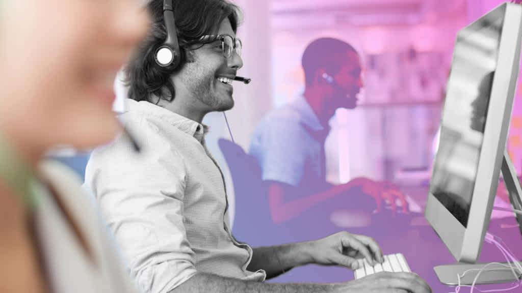 Employees wearing headsets and talking on Qa/automation Engineering