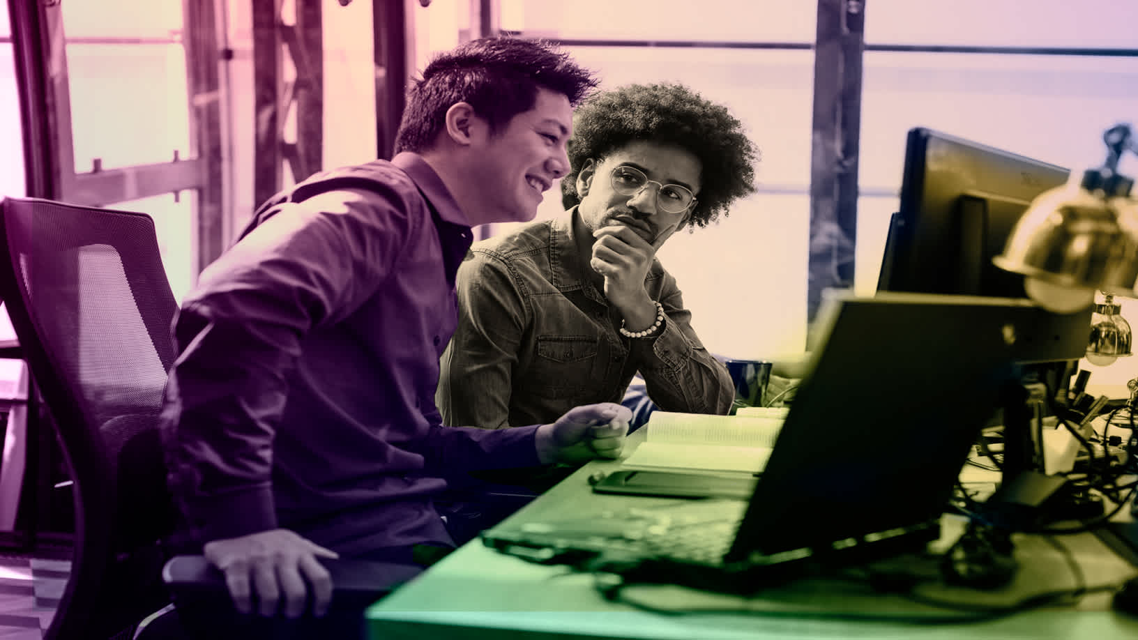 Two male colleagues in an office on Early Talent Technology Careers