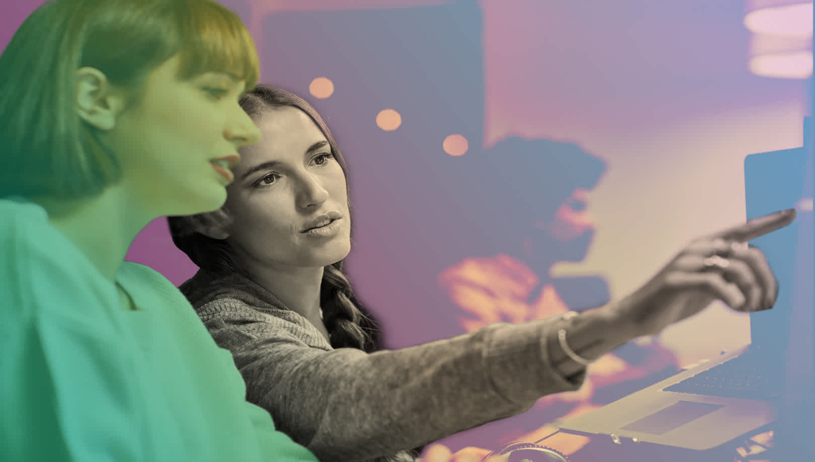 One woman demonstrating on a board to another female colleague on Experienced Talent Technology Careers