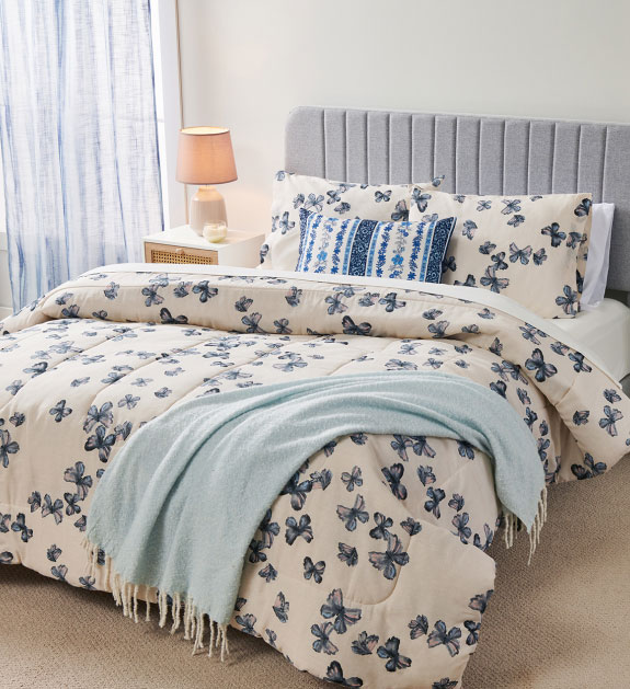 Comforter set that features blue butterflies.