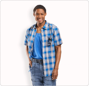 A man wearing a blue t-shirt with a blue plaid button-up and denim jeans