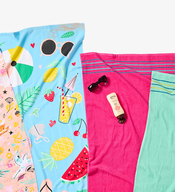 Various beach towels, sunscreen, sunglasses