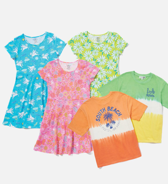 Three kids dresses with various colours and prints. Two kids t-shirts in an orange and white colour block design and a green, white and yellow colour block design. 