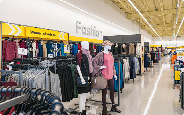 The interior view of inside a Giant Tiger store with a view of the women's fashion department. 