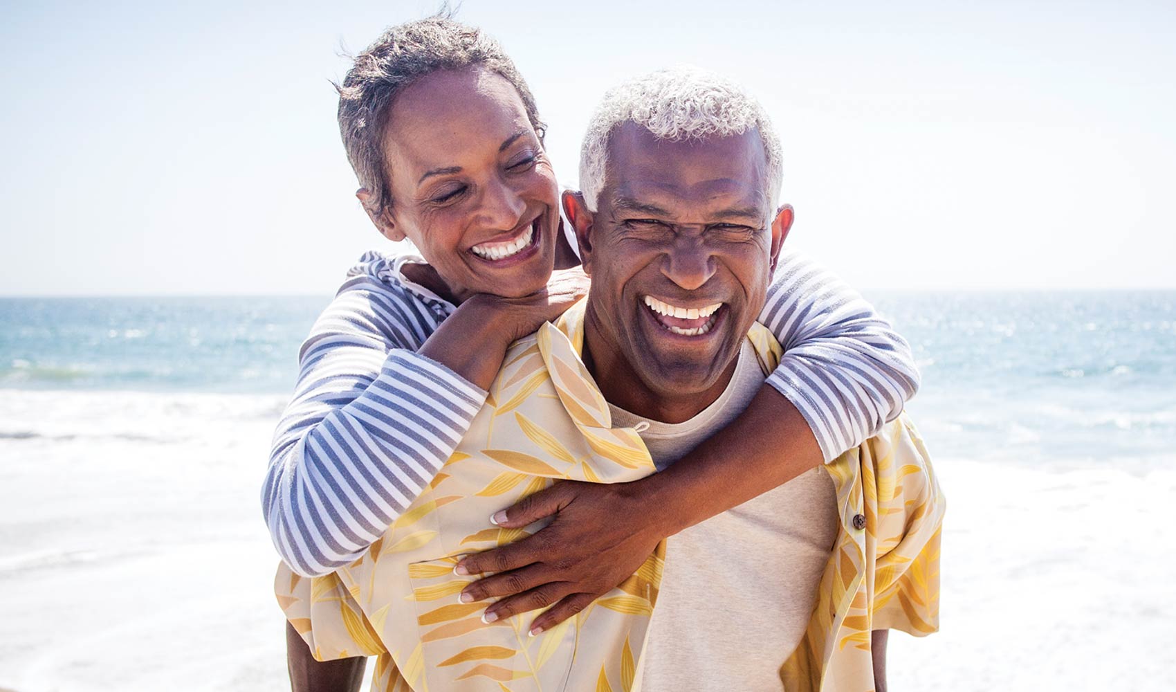 Two seniors laughing outside