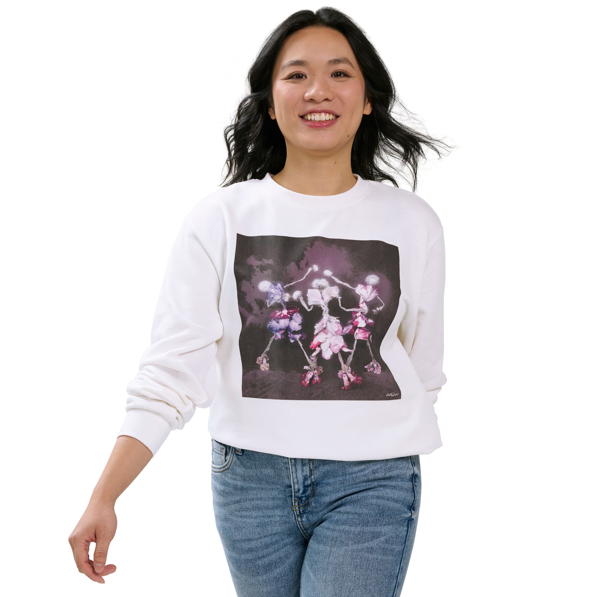 Artist, Linh VH Nguyen modeling a white sweatshirt with her artistic design featured on the front. 