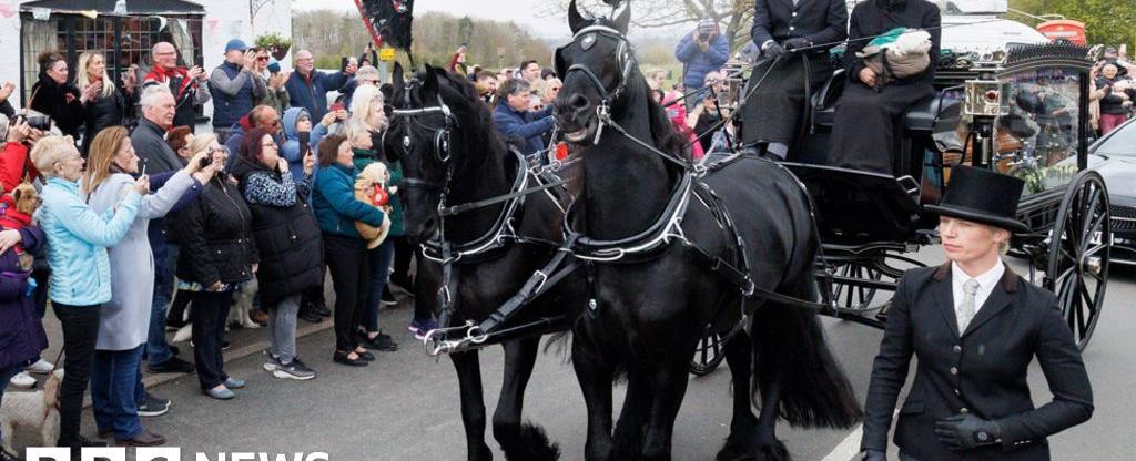 Paul O'Grady: Fans and dogs line streets for star's funeral