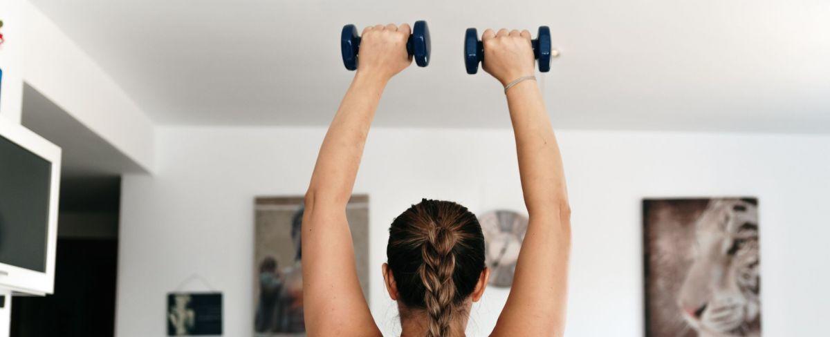 Build a stronger core without sit-ups using this four-move dumbbell workout