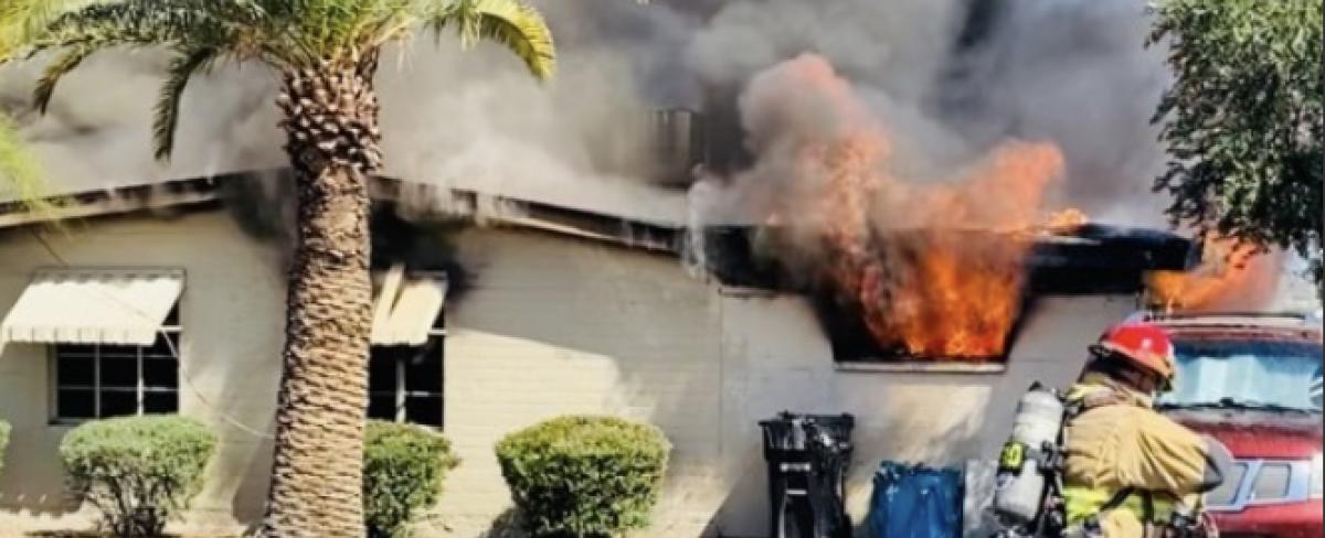 Eleven people, six dogs displaced after house fire in central Phoenix