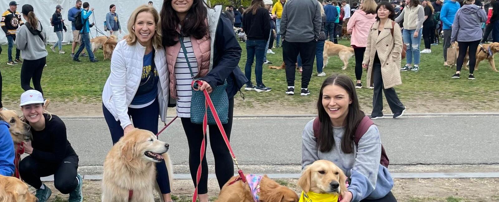 Golden retrievers cross Boston Marathon finish line to honor beloved dogs Spencer and Penny