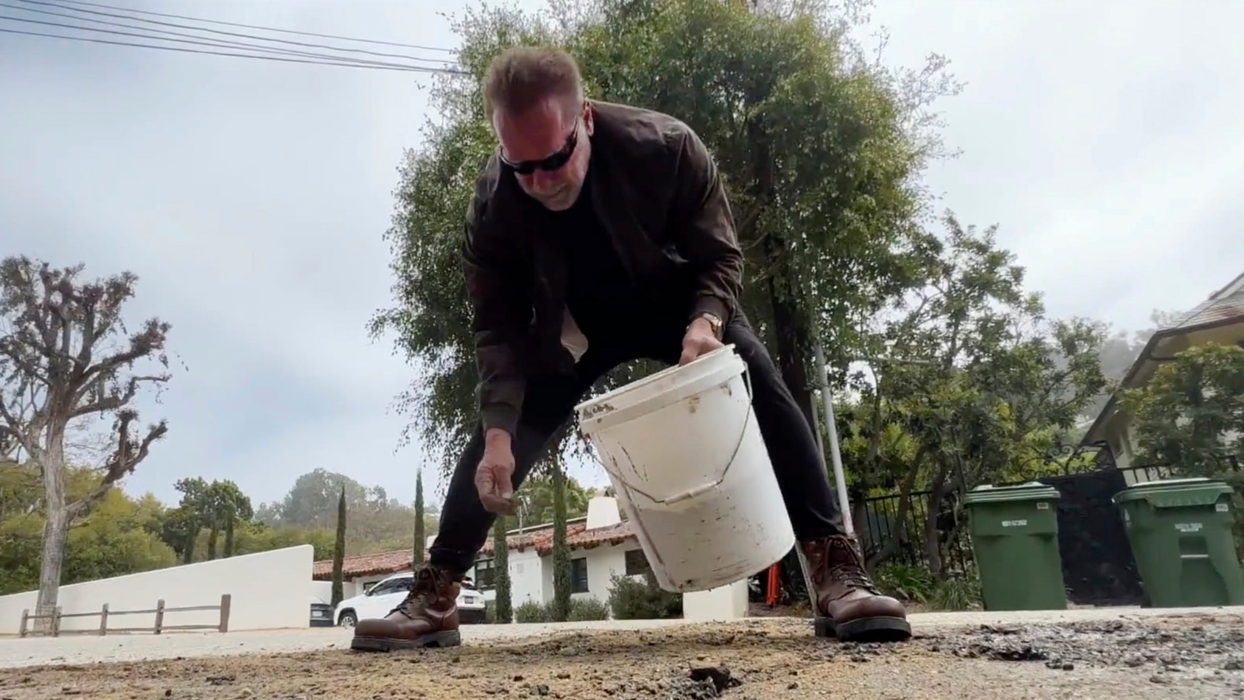 Arnold Schwarzenegger fills neighborhood pothole: 'Let's not complain'
