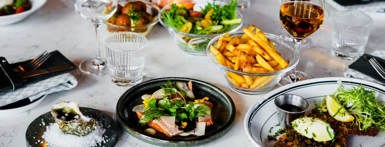 Colorful food on the table at restaurant NÒR in Umeå.