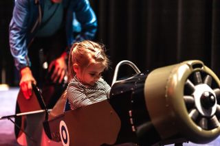 Child flying a toy airplane at Clarion Hotel Helsinki Airport