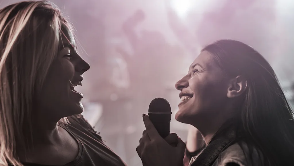 Girls singing karaoke