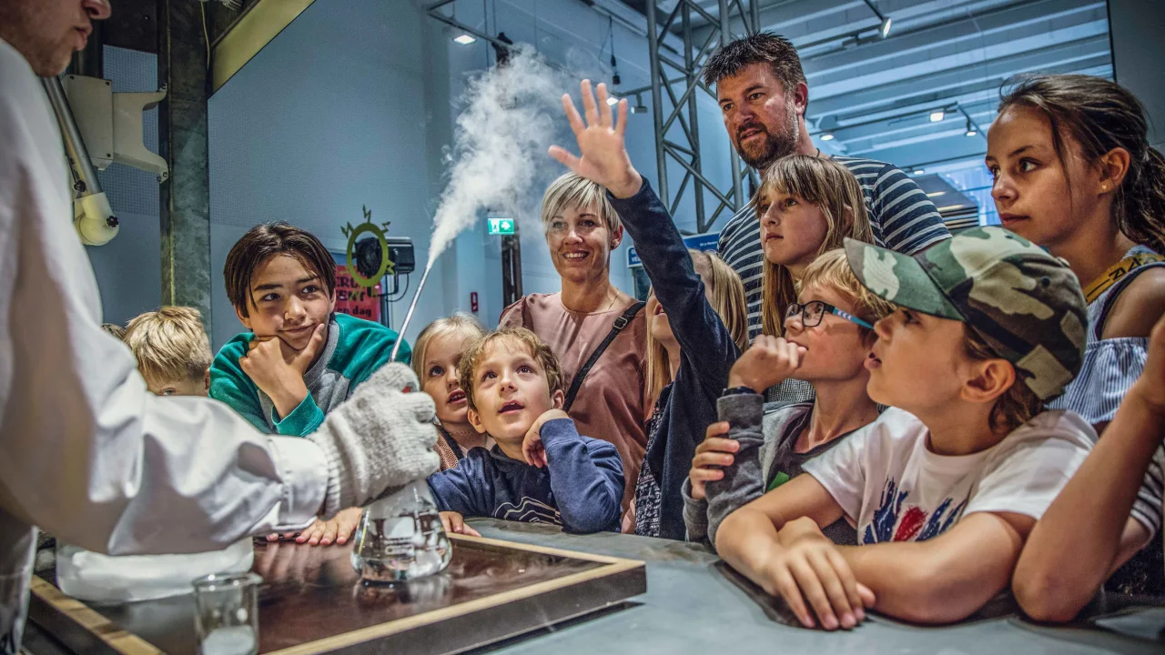Children around a table at Experimentarium in Copenhagen.