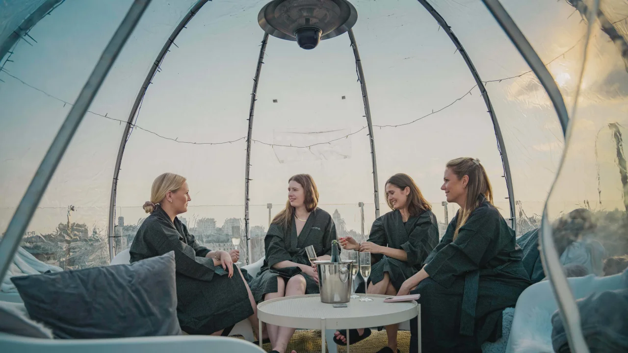 Girls in a tent at the rooftop of Clarion Hotel Sign, Selma City Spa.