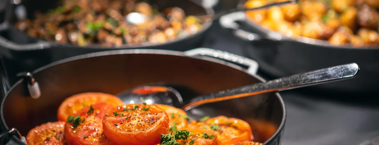 Tomatoes frying in the pan at a restaurant at Quality Hotel.