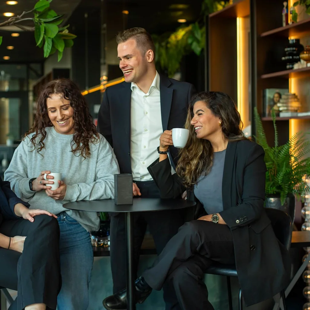 Staff talking and laughing together