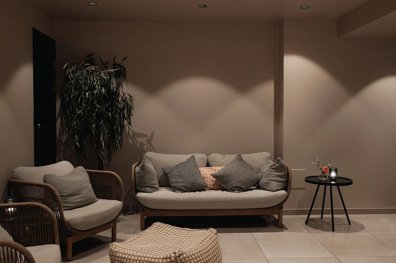 A cozy and inviting lounge area with comfortable seating and soft lighting at Home Hotel Uppsala.