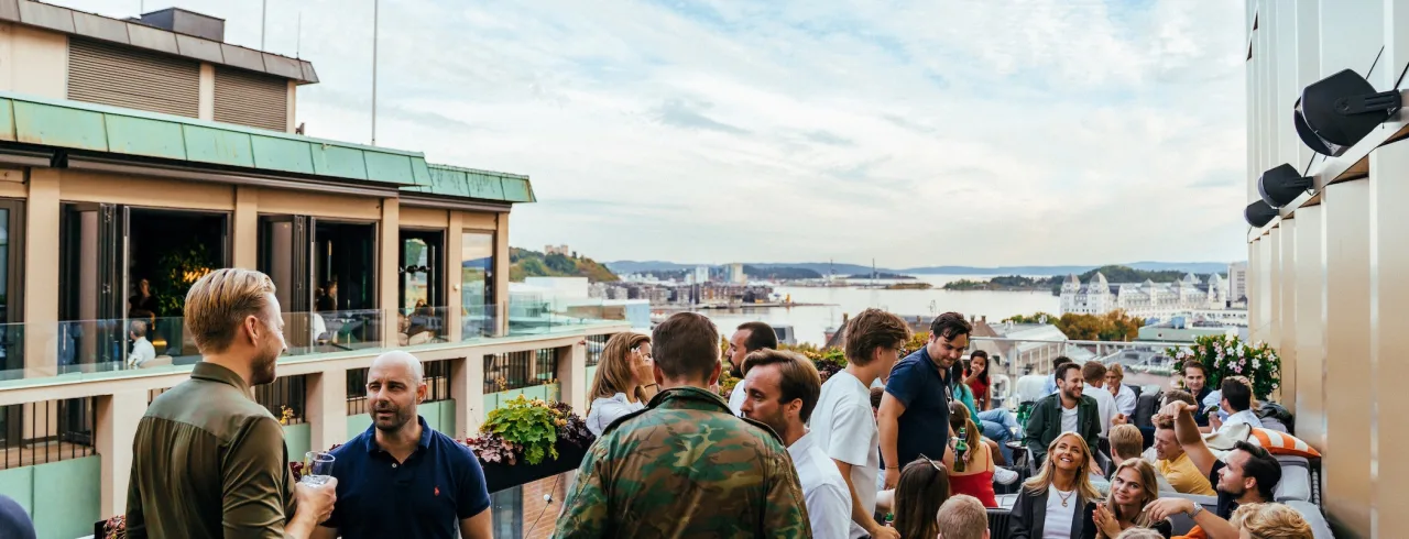 People at rooftop bar at Calmayers Hage with view over Oslofjorden, Clarion Hotel Oslo.