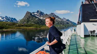 Woman looking out from Hurtigruten ship