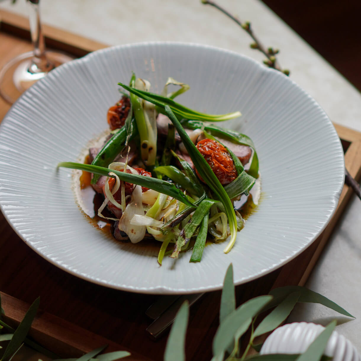 A delicious green food dish, served on a white plate.