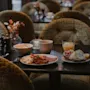 A table laden with a tempting breakfast, including savory and sweet options, at Home Hotel Kung Oscar.