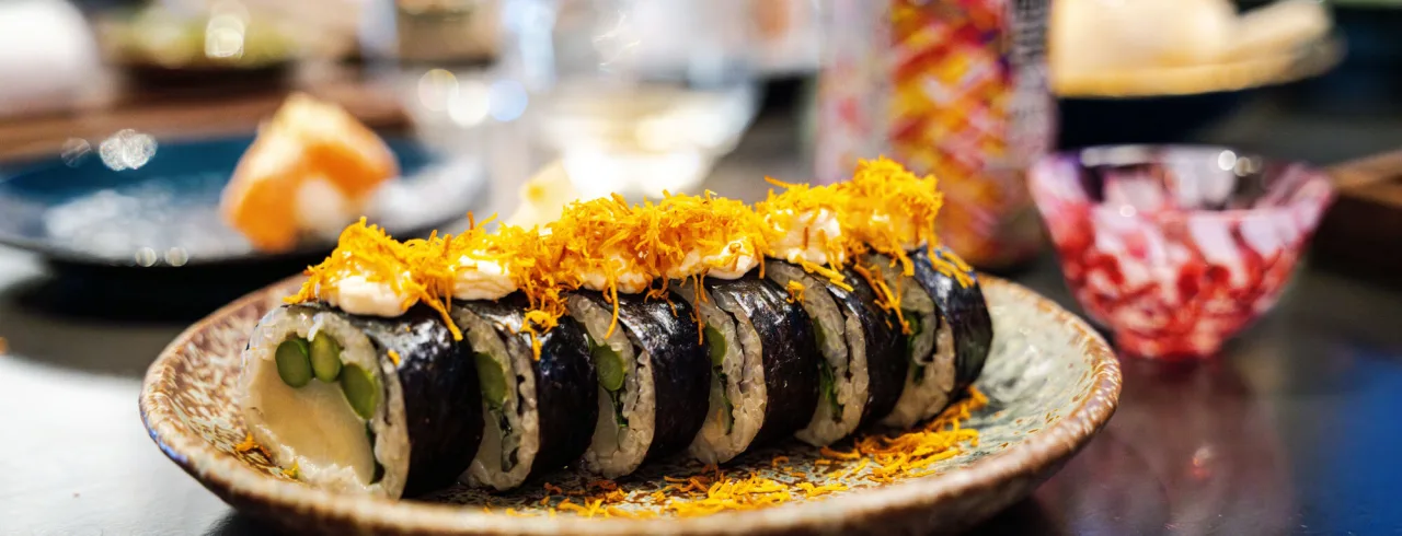 Colorful sushi plate at restaurant.