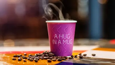 Coffee at Quality Hotel in a purple mug that says: a hug in a mug.