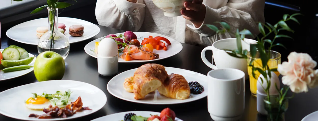 Girl eating breakfast at a hotel in Bergen.