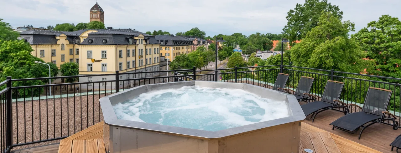 Jacuzzi on the rooftop at Clarion Collection Hotel® Slottsparken, with a city view.