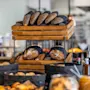 Freshly baked bread and pastries displayed on a buffet at Comfort Hotel Vesterbro, ready for guests.