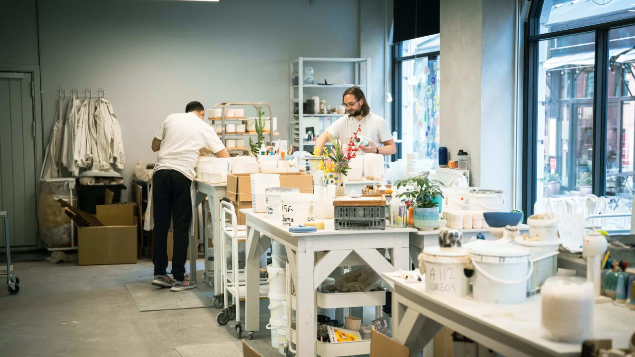 People working in a studio for handcrafted ceramics.
