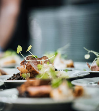 Dinner plates being served in the restaurant at Clarion Hotel Gillet.