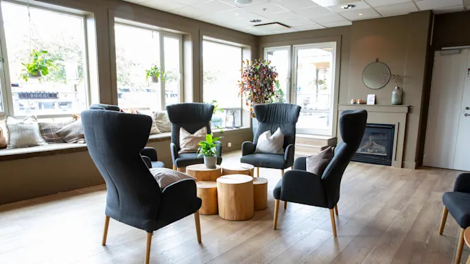 Seating area with chairs at Home Hotel Bryggeparken