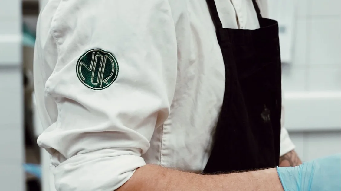 Chef in the kitchen at restaurant NÒR in Borås.