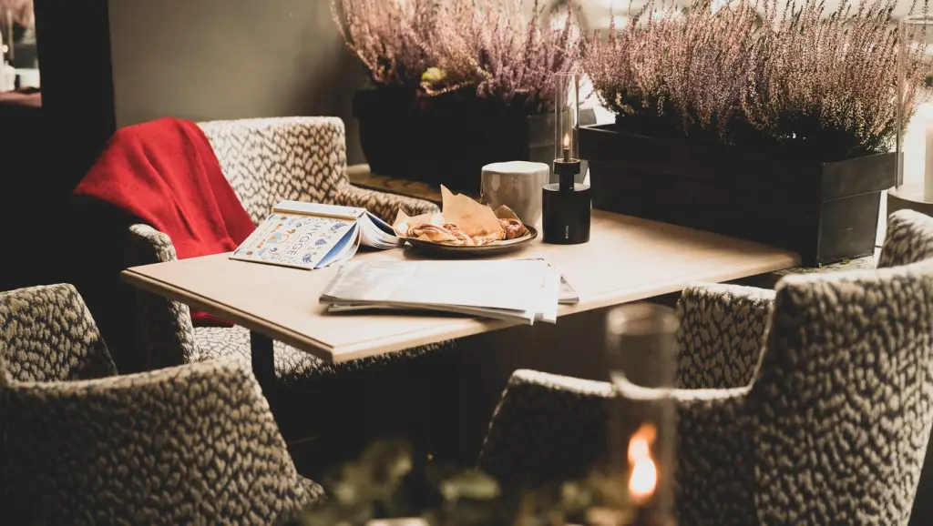 Book at a table, hygge at Clarion Collection Hotel