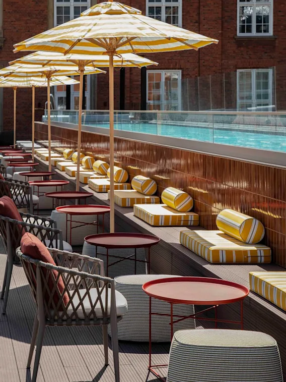 Lounge chairs by the pool at Villa Copenhagen.